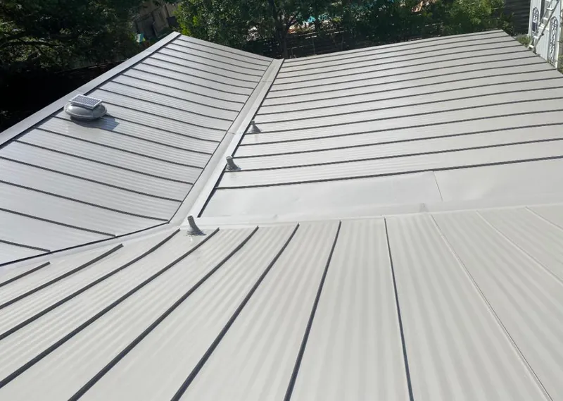 Solar attic fan installed on a metal roof for Roof Ventilation in Bossier City